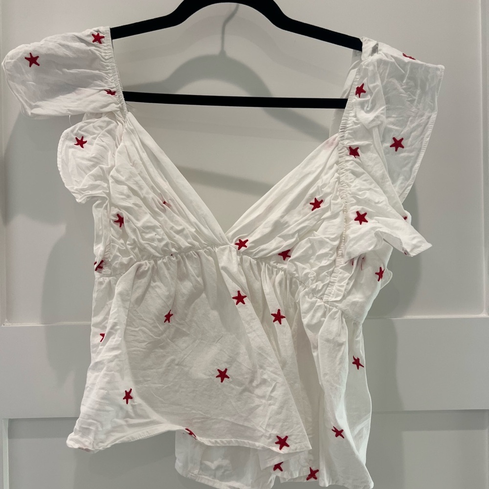 Elegant White Blouse with Red Star Accents